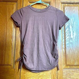 Dark pink girl’s shirt with ruffle ties on each side in great condition.(size L)